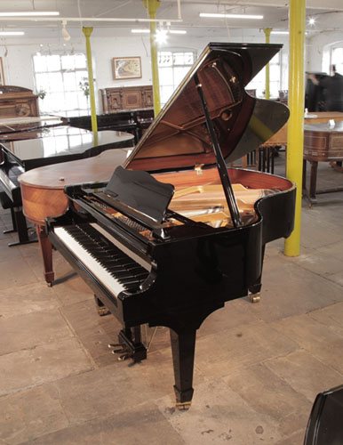 Reconditioned,  2017, W. Hoffmann V158 baby grand piano for sale in black gloss. Piano has an eighty-eight note keyboard and a three-pedal lyre. 