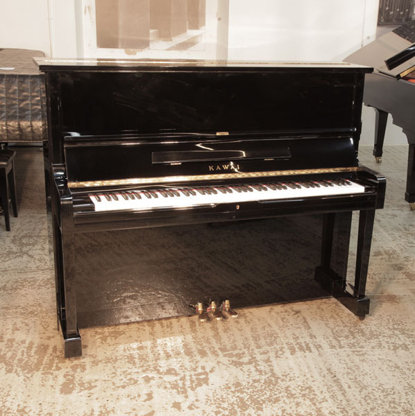 Reconditioned, 1987, Kawai  BS-20  upright piano for sale with a black gloss case. Piano has an eighty-eight note keyboard and three pedals.  