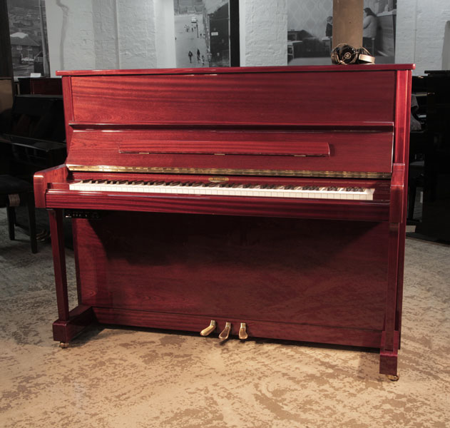 Reconditioned, 2013, Kemble K121CL upright piano in mahogany gloss with fitted Yamaha silent system. Piano has an eighty-eight note keyboard and three pedals