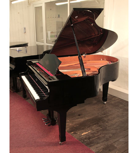 Moutrie grand piano for sale with a black case and chrome fittings..  Piano has an eighty-eight note keyboard and a three-pedal lyre