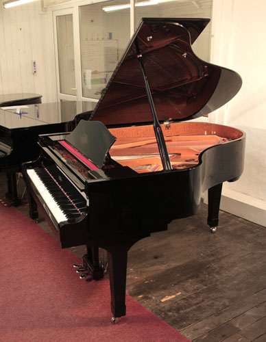 Moutrie grand piano for sale with a black case and chrome fittings