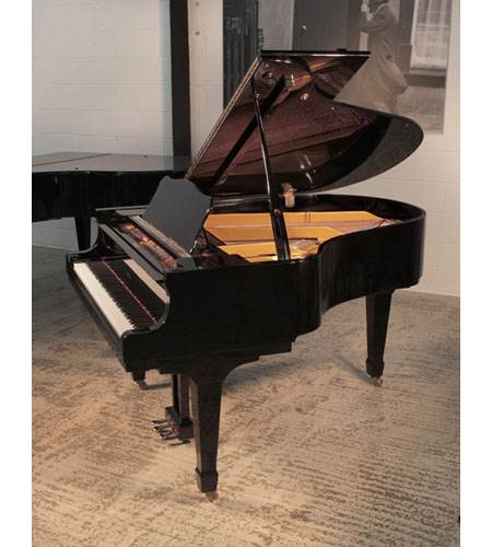 Reconditioned, 2010, Opus grand piano for sale with a black gloss case and brass fittings.