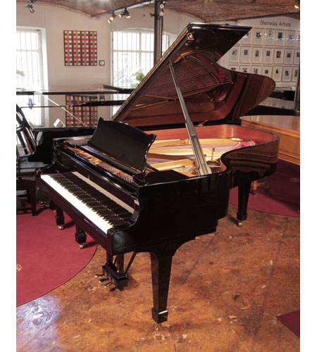 Reconditioned, 2006, Steinway Model B grand piano with a black gloss case and spade legs. Piano has a three-pedal lyre and an eighty-eight note keyboard.  