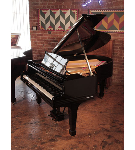 Rebuilt,  1921, Steinway Model O grand piano has a black case and brass fittings. Piano has an eighty-eight note keyboard and a two-pedal lyre. 