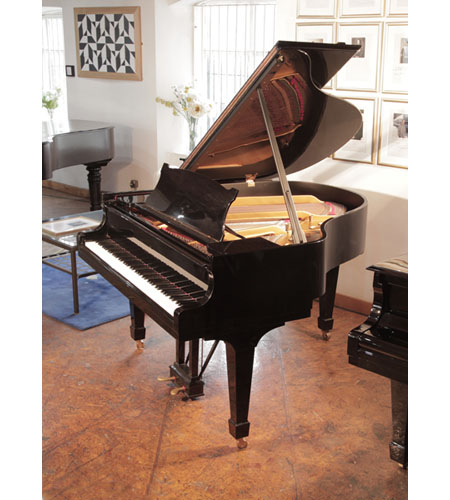 A 1951, Steinway Model S baby grand piano for sale with a black case. Piano has an eighty-eight note keyboard and a two-pedal lyre.