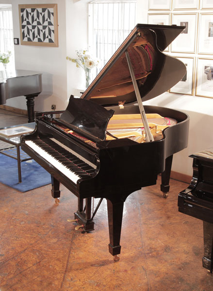 A 1951, Steinway Model S baby  grand piano for sale with a black  case and spade legs. Piano has an eighty-eight note keyboard and a two-pedal lyre.