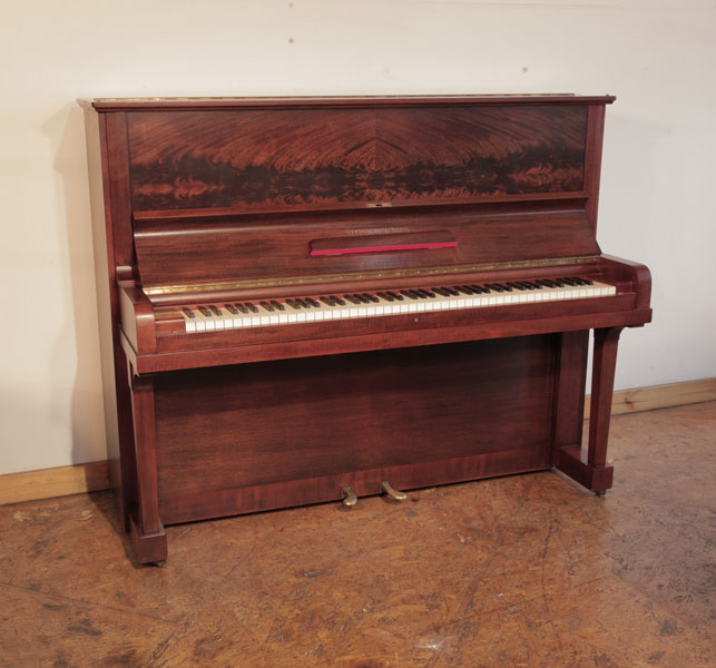 Reconditioned 1937, Steinway Model V  upright piano for sale with a polished mahogany case and book-matched flame mahogany front panel. Piano has an eighty-eight note keyboard and two pedals. 