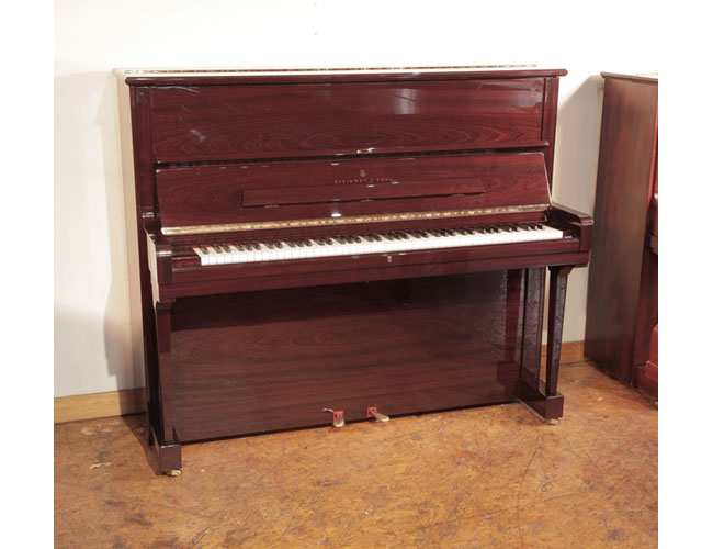   As new, 2009, Steinway model V upright piano with a mahogany gloss case. 
