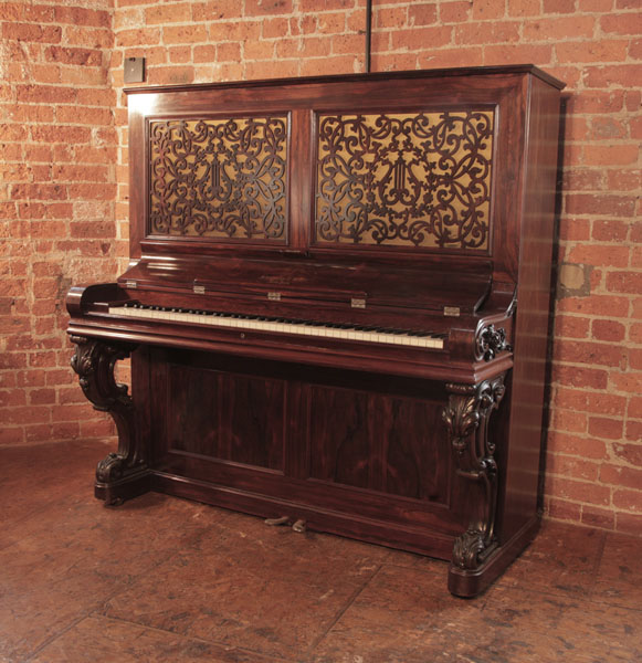 World's Oldest, 1862, Steinway  upright piano for sale with a polished, rosewood case carved, reverse scroll legs. Cabinet features openwork panels in an arabesque design. Exquisite antique styling. Piano has eighty-five notes and two pedals. 