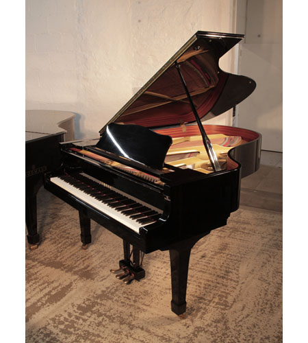 Reconditioned, 1981, Yamaha C5 grand piano for sale with a black gloss case and spade legs. Piano has an eighty-eight note keyboard and a three-pedal lyre. 