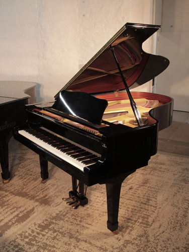 Reconditioned, 1981, Yamaha C5 grand piano for sale with a black gloss case and spade legs. A large grand piano with broad tonal range and power.   