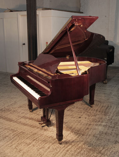 Reconditioned, 1972, Yamaha G2 grand piano with a mahogany case and spade legs. Piano has an eighty-eight note keyboard and a two-pedal lyre. 