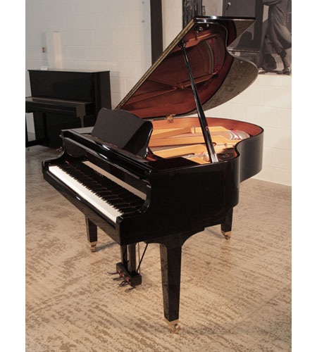  Reconditioned, 2005, Yamaha GB1 baby grand piano for sale with a black, gloss case and square, tapered legs. Piano has an eighty-eight note keyboard and a three-pedal lyre. 
