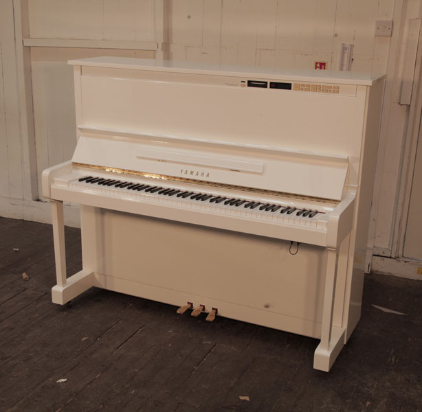 Yamaha MX100A Disklavier upright piano in white gloss upgraded to a modern system to use a digital apple device. Piano has an eighty-eight note keyboard and three pedals 