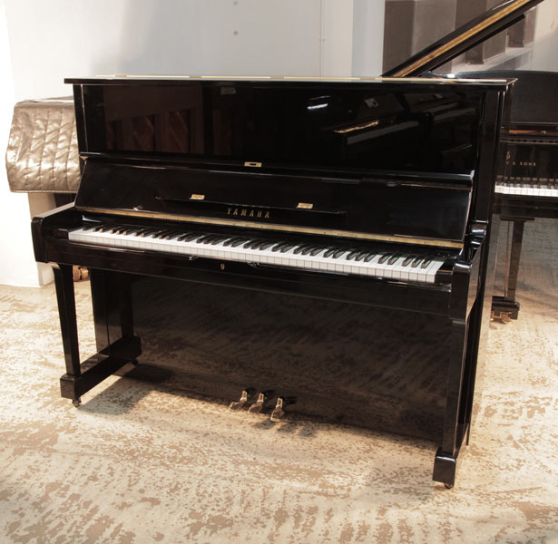 Reconditioned,  1977, Yamaha U1 upright piano in black gloss with brass fittings 